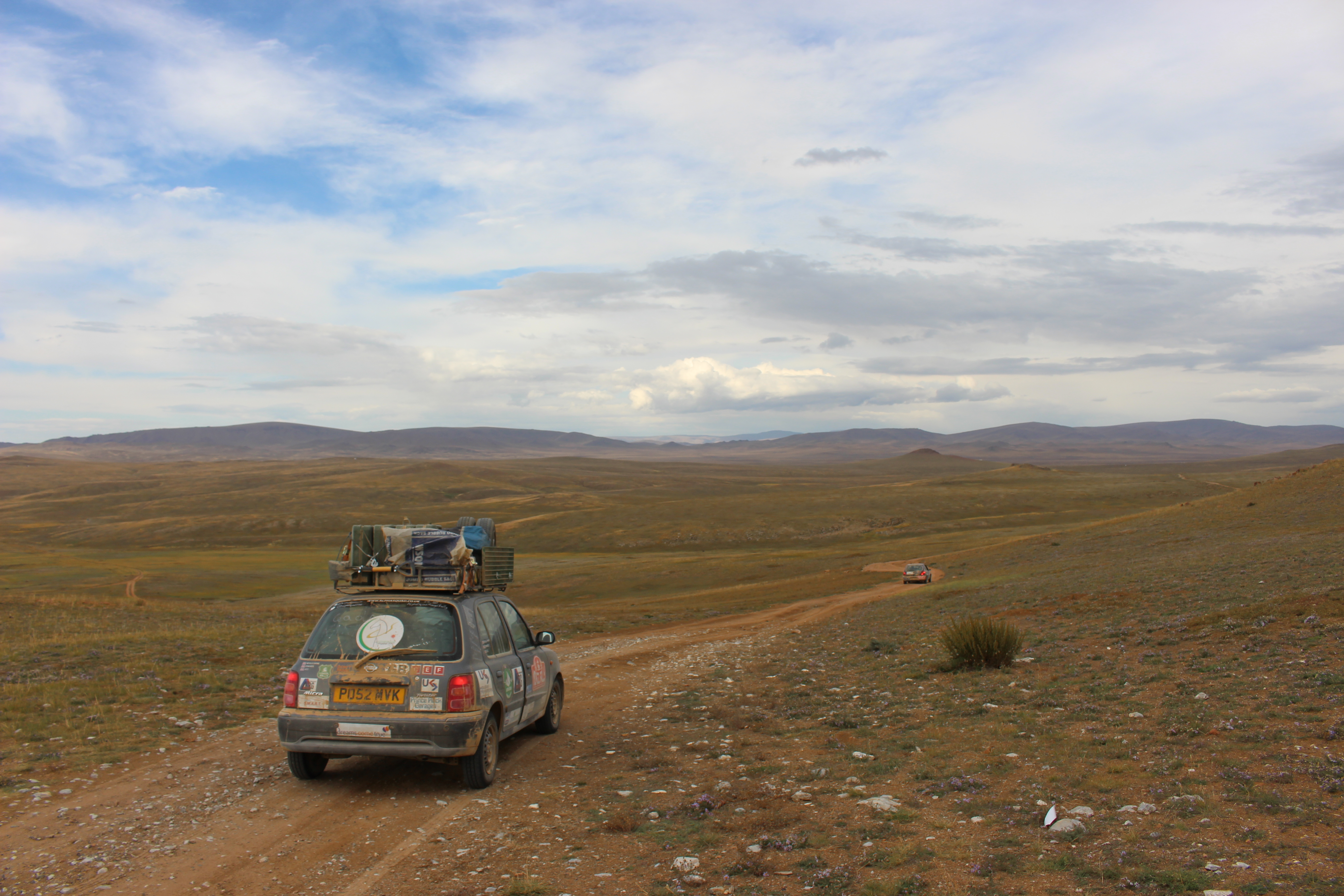 Micra on dusty roads crossing the vast Mongolian landscape